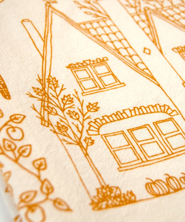 Illustration detail of the fall tea towel, printed in fresh pumpkin orange
