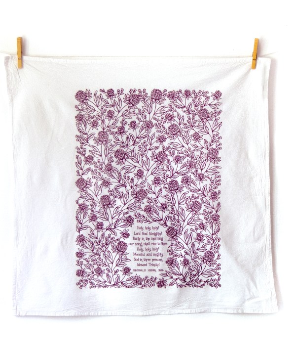 Holy Holy Holy hymn towel printed in royal purple, folded and displayed unfolded and hanging with clothes pins