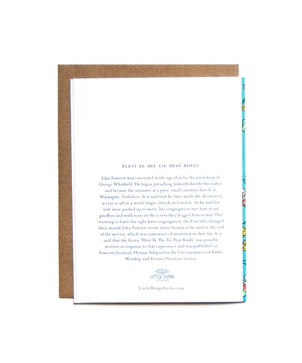 The Blest Be the Tie greeting card features delicate floral illustration with a bright blue background. The history of the hymn's origin is printed on the back, shown here.