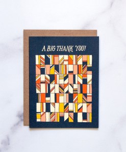 The Big Thank You greeting card by Little Things Studio features a retro geometrical design against a navy background with a blank inside, shown against a marble background.
