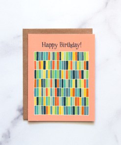The Happy Birthday! Greeting Card features hand illustrated geometric design in a rainbow of hues against a happy peach background—a blank artsy greeting card ready for your messages of affirmation.