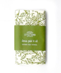 Jesus Paid It All hymn tea towel printed in fresh olive green, folded and wrapped with a belly band perfect for gifting