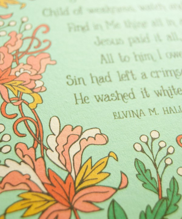 Hand illustrated floral detail of the Jesus Paid It All art print — hand-lettered hymn text printed on a light green background surrounded by floral accents in pink, light red, white, orange and green
