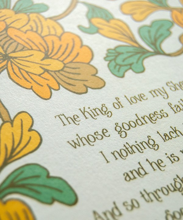 Hand lettered text detail of The King of Love My Shepherd Is art print — hymn wall art printed on cream background, with a hand illustrated floral detail in shades of muted orange and green.