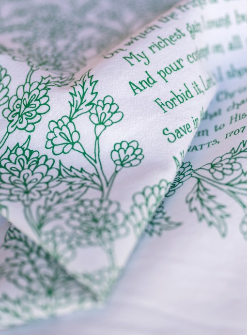 Hand illustrated detail of the When I Survey the Wondrous Cross hymn tea towel, which features the beloved hymn printed in brilliant emerald green.