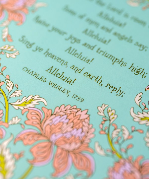 Text detail of hymn art print of Christ the Lord is Risen today, featuring hand-lettered hymn text and hand illustrated florals in corals and pinks against a mint green background
