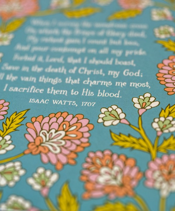 Illustration detail of When I Survey the Wondrous Cross hymn art print, which features the hymn text surrounded by a floral illustration in coral and pink against a blue-green background.